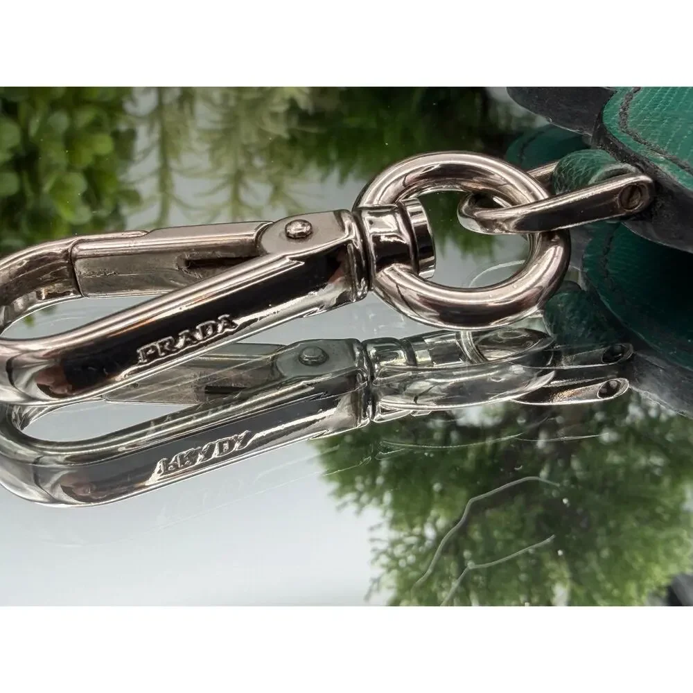 Prada studded heart keychain made of green saffiano leather